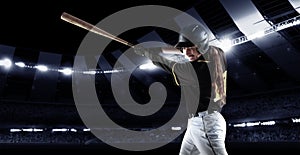 Poster with professional baseball player with baseball bat in action during match in crowed sport stadium at evening
