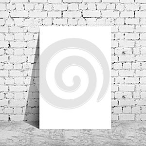 Poster standing next to a brick wall