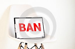 A poster with the word Ban. The sign of the ban and a miniature toy aircraft. Ban on flights of civil aircraft. Forbidden zone.