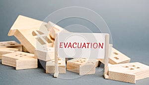 A poster with the words Evacuation and fallen wooden houses. Removal of people, institutions, property from hazardous areas.