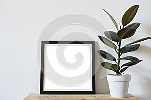 Posters square format in black frame in white stylish modern interior on shelf, living room. Design template mockup