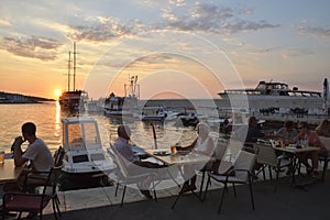 Postira, Croatia - August 26, 2016: Tourist having dinner near the harbor in the little village Postira on Brac Island in Croatia