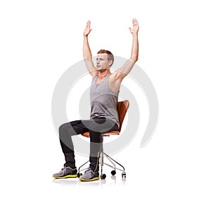 Posture, exercise and man on chair stretching for health and fitness in white background or studio. Sitting, workout and