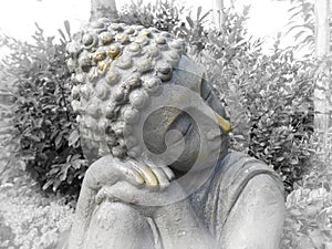 Buddha dreaming in the garden photo