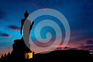 The Posture Of Walking Buddhist Statue In Twilight Silhouette