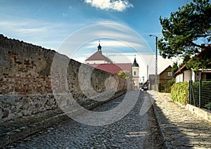 poswietna street with a view of the church of the holy trinity in tykocin