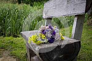 Posy of fresh spring flowers on a rustic bench