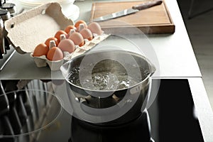 Pot with boiling water on electric stove