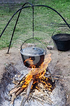 Pot of cooking food on the fire