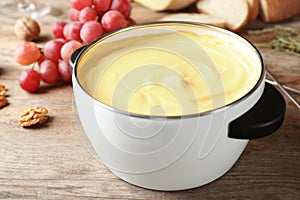 Pot with delicious cheese fondue