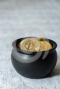 Pot of gold bitcoins on a white and gray crackle background