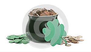 Pot of gold coins and clover on white. St. Patrick`s Day celebration