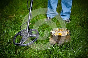 Pot of golden coins collected with metal detector