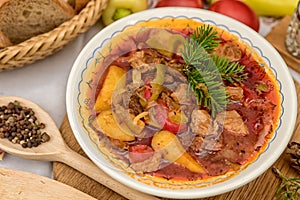 Pot goulash with divas placed on the table of ingredients