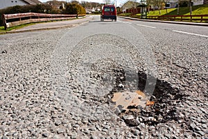 Pot hole in residential road surface