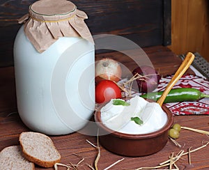 Pot of homemade organic yogurt  with bread. photo