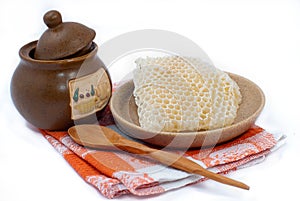 Pot of honey and honeycomb