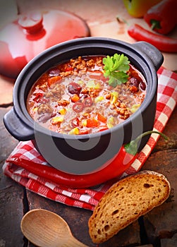 Pot of hot and spicy Mexican chili photo