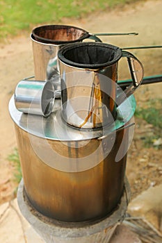 Pot of hot water boiler on wood fueled stove with coffee filter