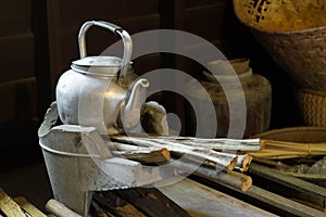 A pot on old stove in rural kitchen.