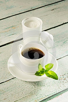 Pot of stevia sweetener and coffee photo