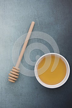 Pot of sweet honey with honey drizzle