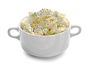 Pot with tasty boiled rice and avocado on white background