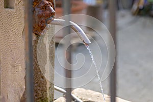 Potable water flowing froma drinking fountain photo