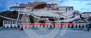 Potala Palace in Lhasa at blue hour view from town square, Tibet Autonomous Region. Former Dalai Lama residence, now is a museum