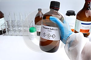 potassium hydroxide in glass, chemical in the laboratory and industry