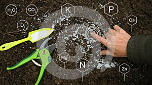 White granular fertilizers on soil, Solve the Fertilizer Crisis photo