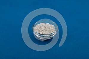 Potassium sorbate, potassium salt of sorbic acid in glass bowl. Food additive E202 used in many personal-care products to inhibit