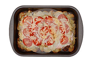 Potato baked pudding with chicken meat, tomatoes and cheese isolated on a white background