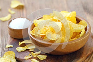 Potato chips in bowl. Fast food.