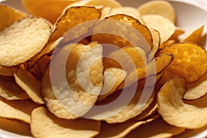 Potato chips in a bowl on a wooden background. easy dip chips, Generative AI