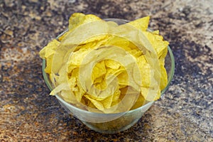 Potato chips or Crispy in a bowl on colorful background