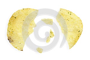Potato chips with crumbs and leftovers isolated on white background, top view. Cracked potato chips isolated on white