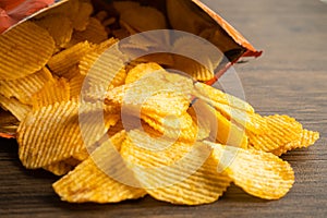 Potato chips, delicious BBQ seasoning spicy for crips, thin slice deep fried snack fast food in open bag