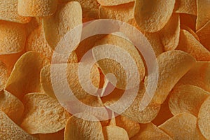Potato chips in direct sunlight for background