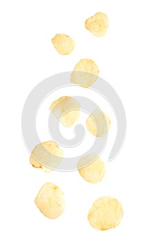 Potato chips falling isolated on white background