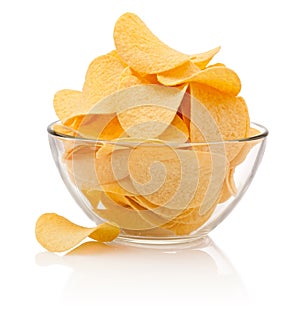Potato chips in glass bowl isolated isolated on white background