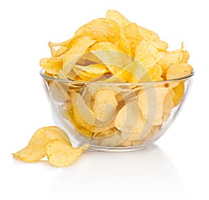 Potato chips in glass bowl on white background