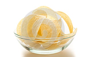 Potato chips in a glass bowl