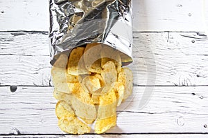 Potato Chips and pack. Packaging of Chip on white background. Top view.