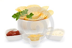 Potato chips with parsley and sauces