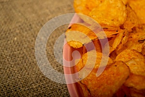 Potato chips on a round platter. Close up