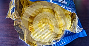 Potato chips with salt in open bag