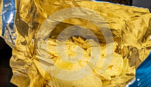 Potato chips with salt in open bag