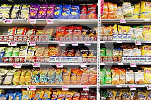 Potato chips and snacks in supermarket