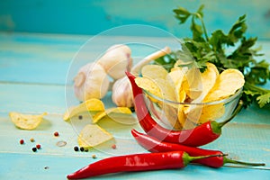 Potato chips with spicy in a glass bowl